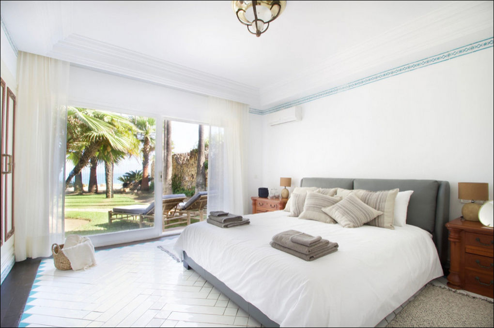 Another bedroom with sea views opening up to the Garden